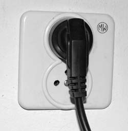Twin mains socket in use