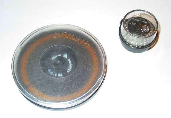 Daisy wheel and golf ball font elements in their protective boxes