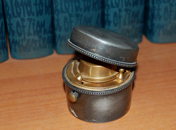 A silver plated travel inkwell