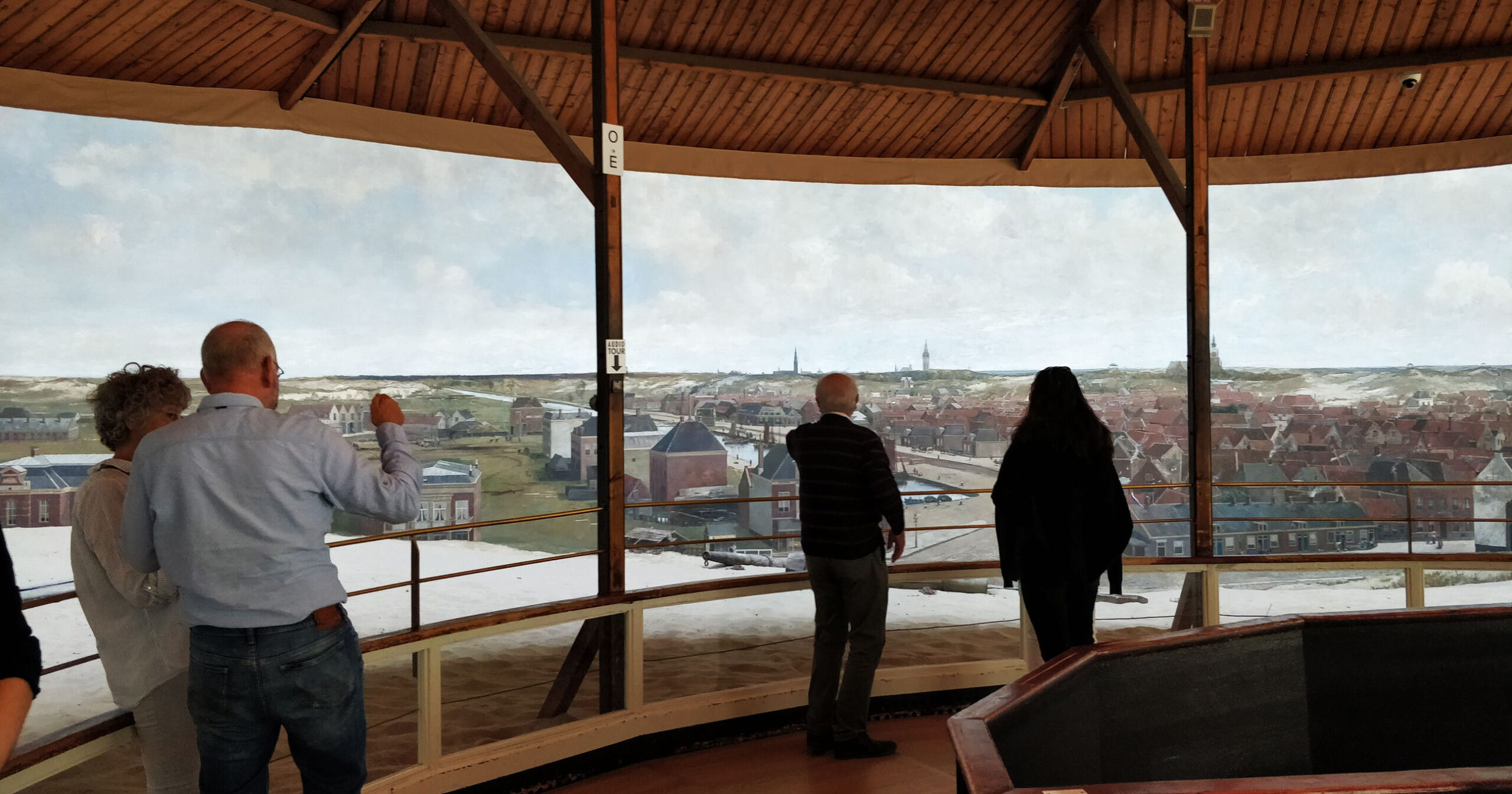 People viewing the Mesdag panorama of 19th century Scheveningen