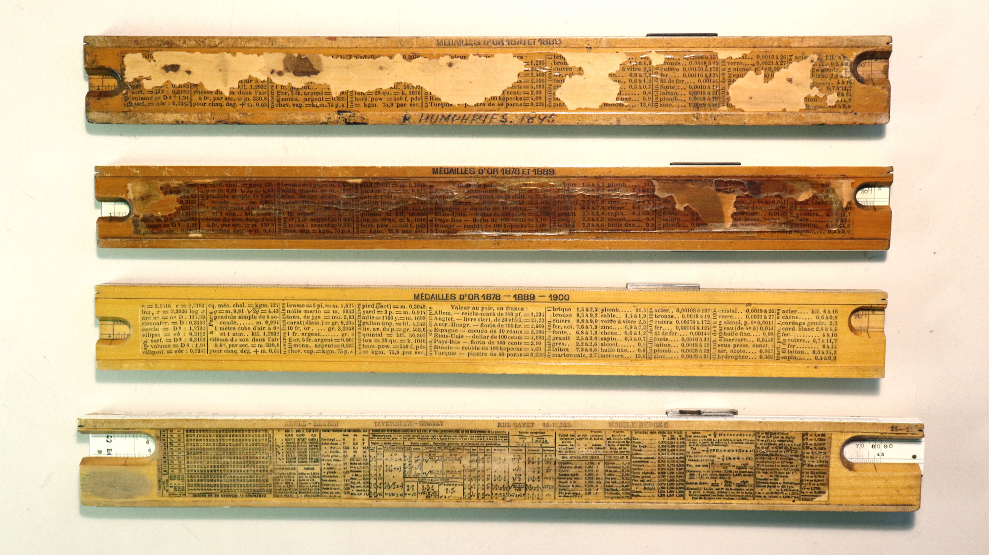 Four Tavernier-Gravet slide rules - back