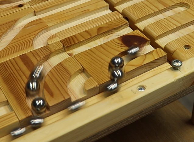 Marbles running to the gutter of Marble Run track.