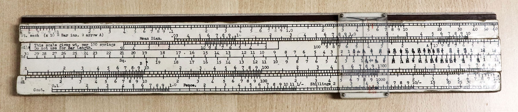 A WW2 artillery slide rule converted to spring design slide rule - front side